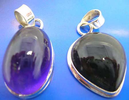  sterling silver pendant with assorted geometrical design amethyst stone inlaid, around edge, assorted design randomly pick