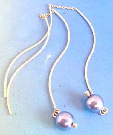  sterling silver curvy threader earring with grey mother of pearl at the bottom