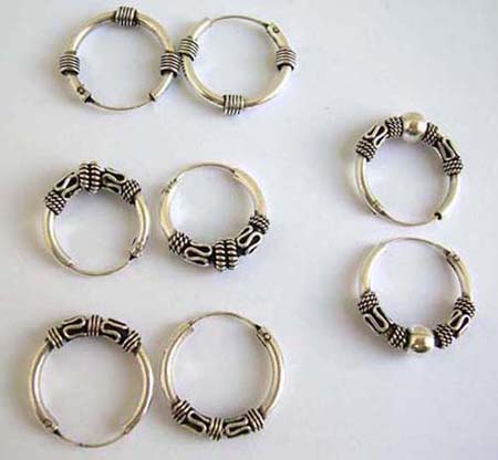  925. sterling silver hoop earrings. comes in an assortment of designs picked randomly by our warehouse staff