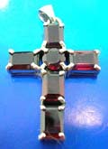 4 retangular and 1 rounded garnet stone forming cross shape sterling silver pendants with 